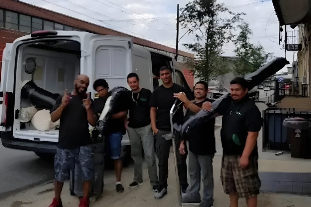 Carpet cleaning crew in Brooklyn NY loading equipment into a service van, showing a professional local team ready for residential and commercial cleaning jobs.